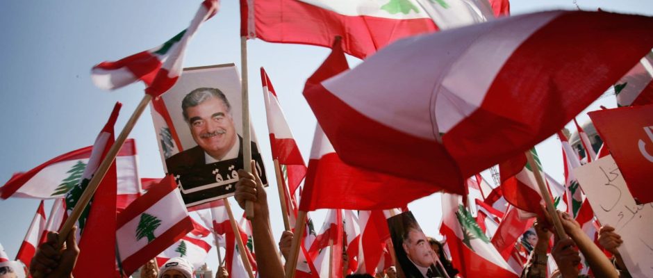 crowds holding his image