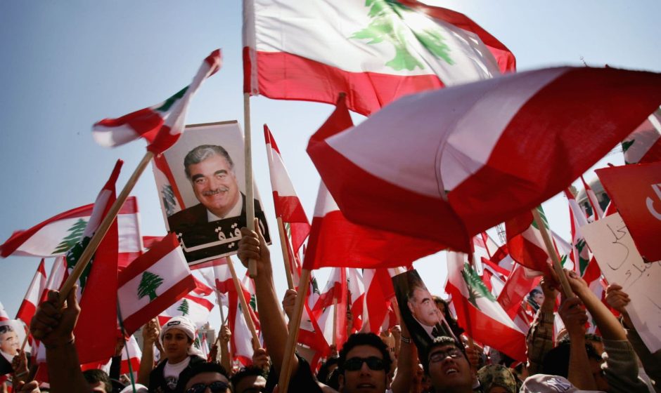 crowds holding his image